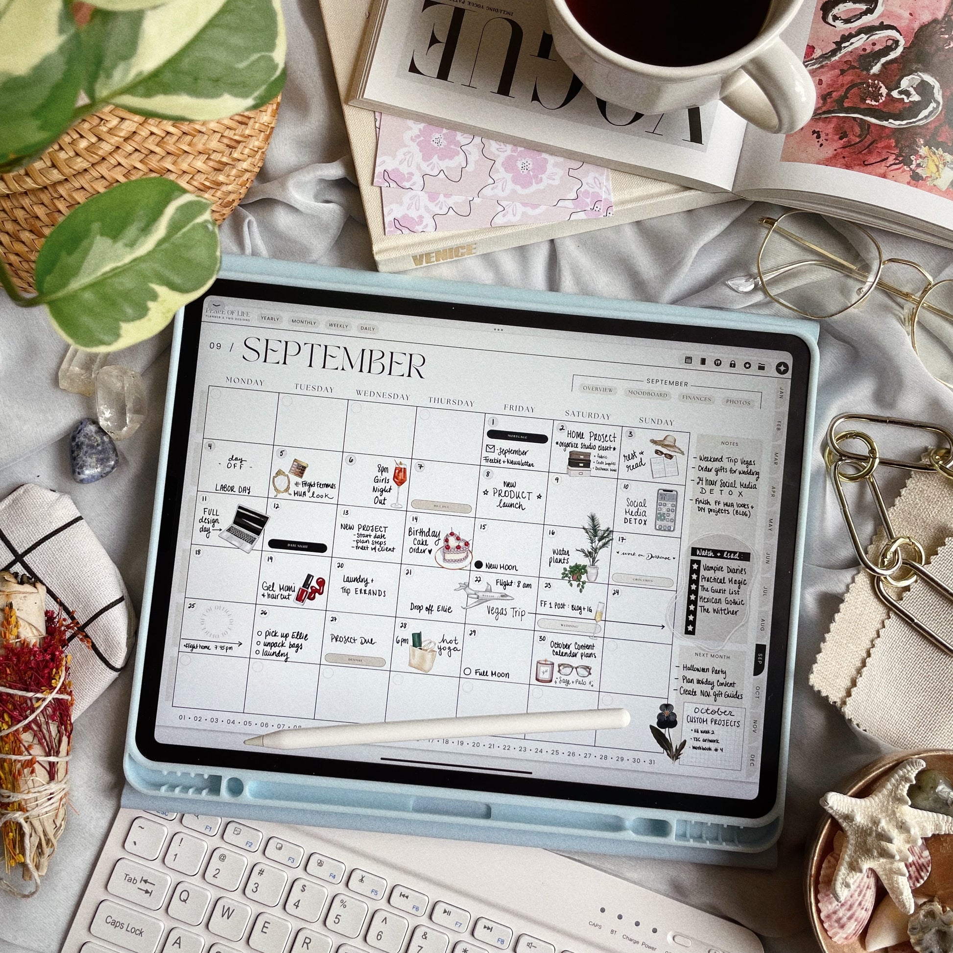 Planner shown on a tablet near a cozy setup with soft fabric and coffee, showcasing a filled-out spread.