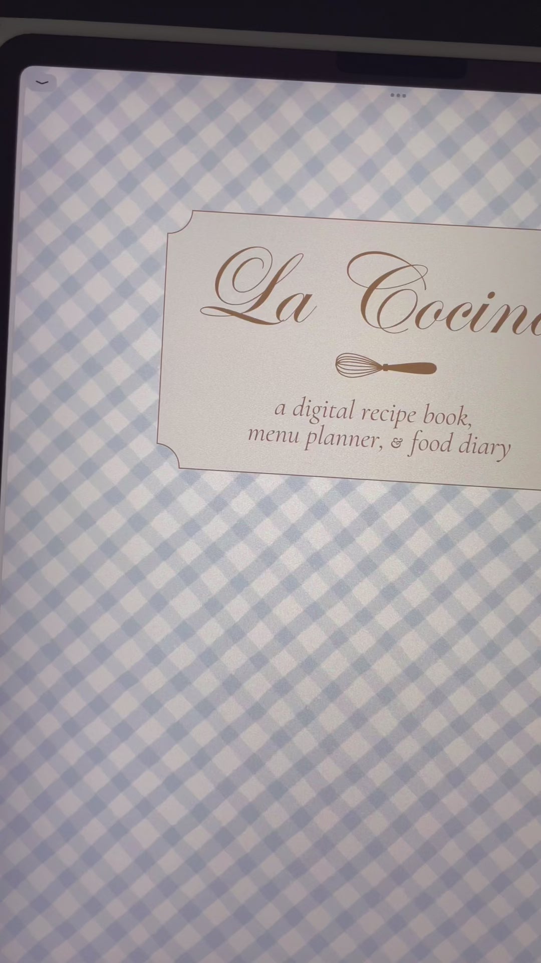 Animated planner cover on gingham background with soft shadows and movement.